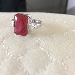 Ring with ruby colored stone